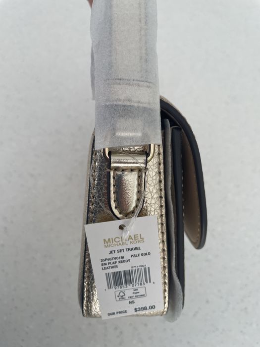 Нова сумка Michael Michael Kors Jet Set Travel, натуральна шкіра, колір pale gold, оригінал, є невеликий дефект.