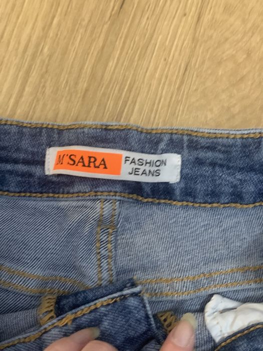 Niebieskie jeansy z dziuramu w kwiaty y2k vintage