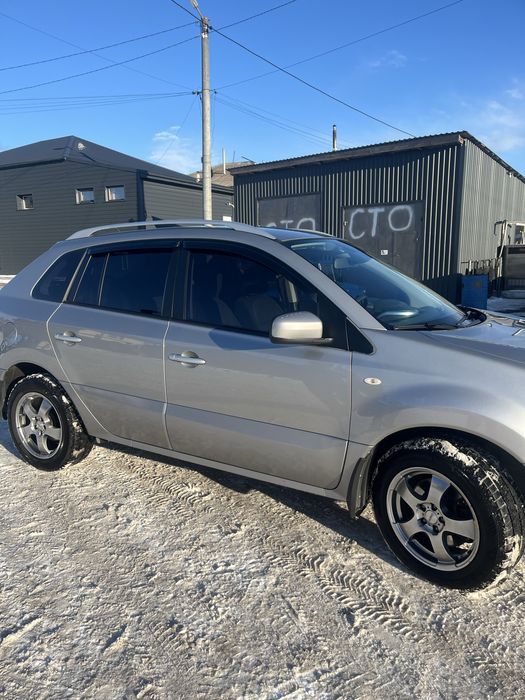 Машина Рено колеус