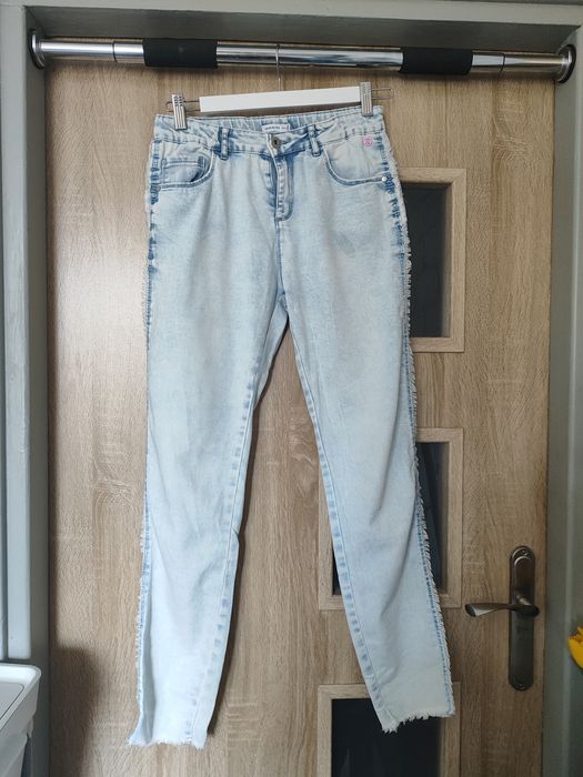 Jasne spodnie frędzle Reserved rozm. 164