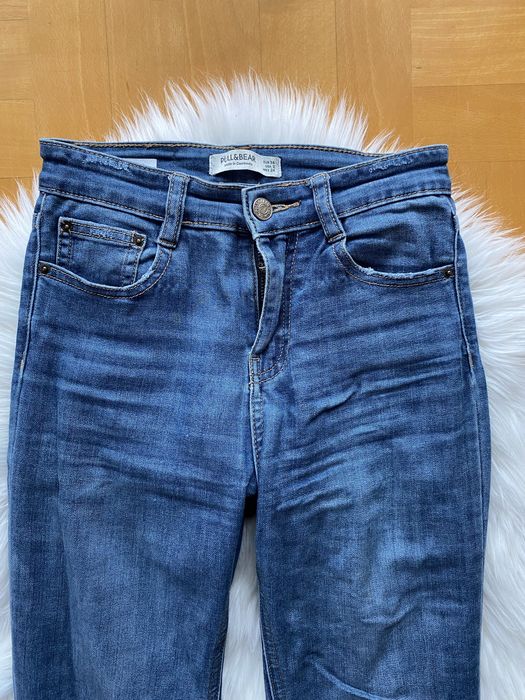 Spodnie damskie jeansowe pull&bear z dziurami skinny