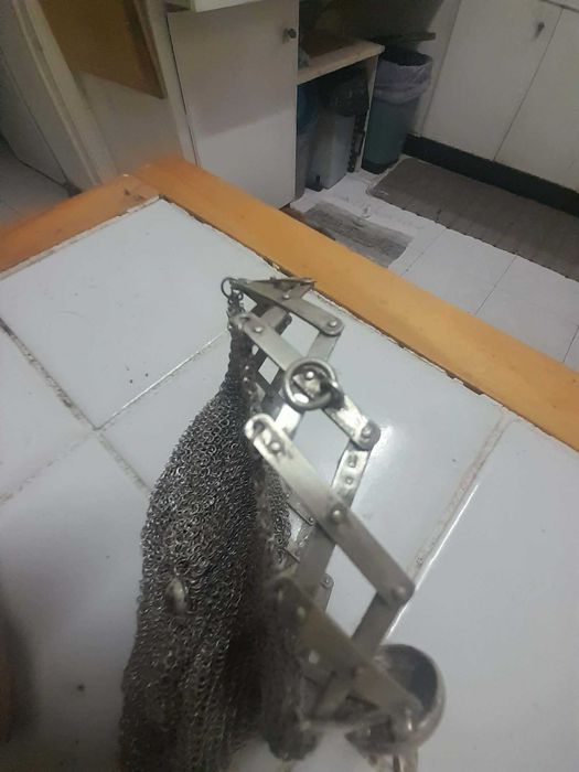 Porta moedas de prata.