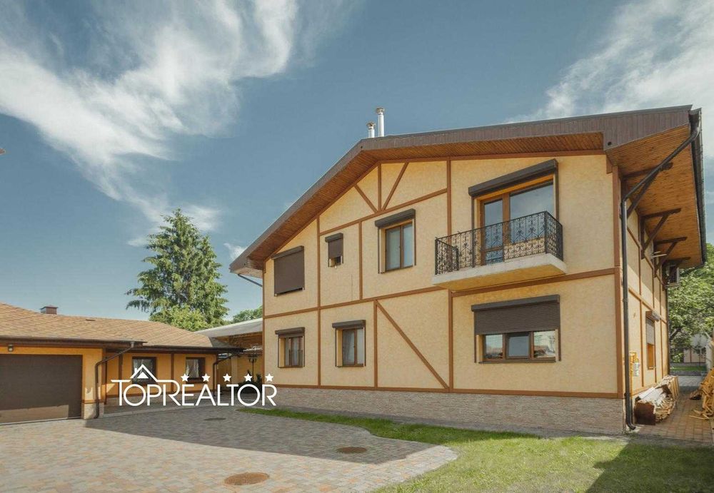 Сучасний заміський котедж із басейном у селищі Високий