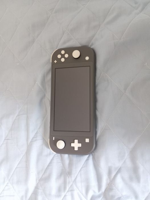 Vendo Nintendo Switch Lite Com 2 Jogos e Bolsa