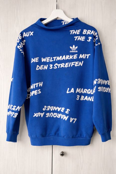 Niebieska bluza Adidas BK5998 NYC Graffiti Crew Sweatshirt
