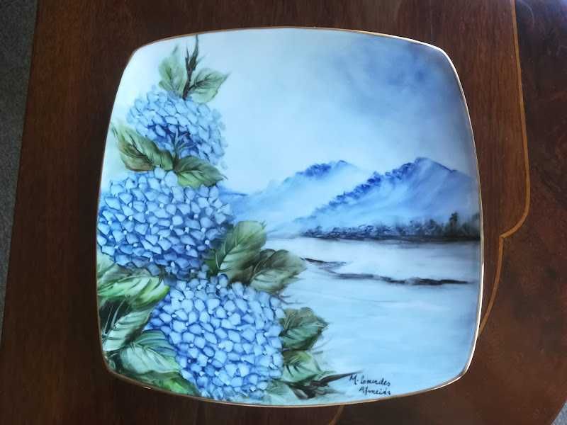 Hand-painted porcelain plates.428625429592156161