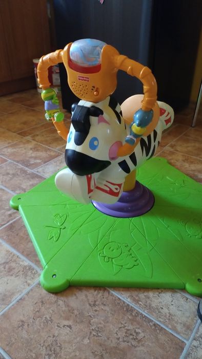 Motorek do pchania,skoczek fisher zebra,konik na biegunach