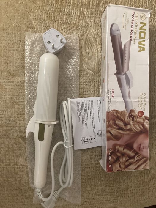 Плойка або щипці для волосся