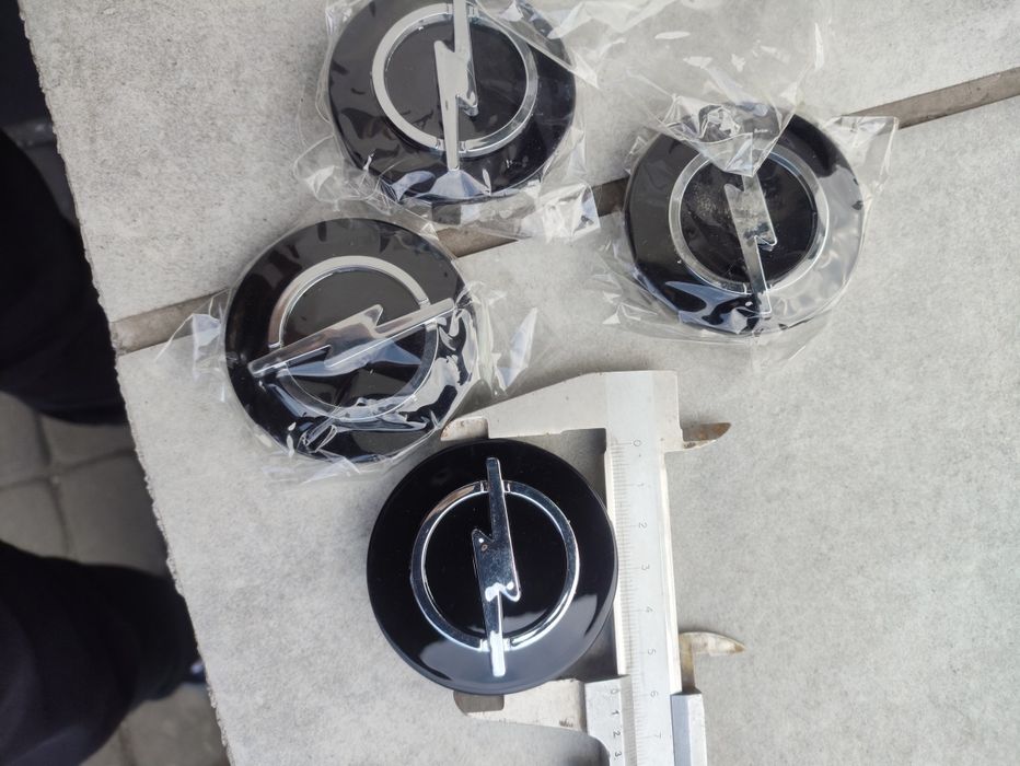 Dekle dekielki opel nowe 58mm / 55mm emblematy logo na alufelgi