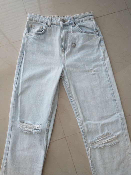Nowe spodnie jeansowe z dziurami XS