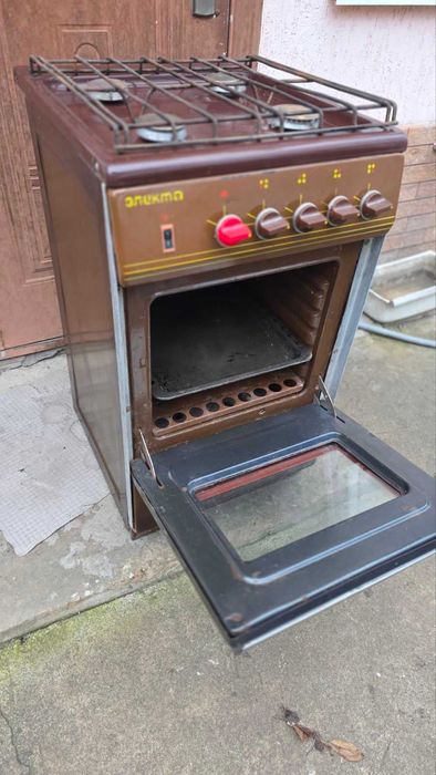 Плита газовая "Электа" 4-х камфорная. коричневая рабочая !