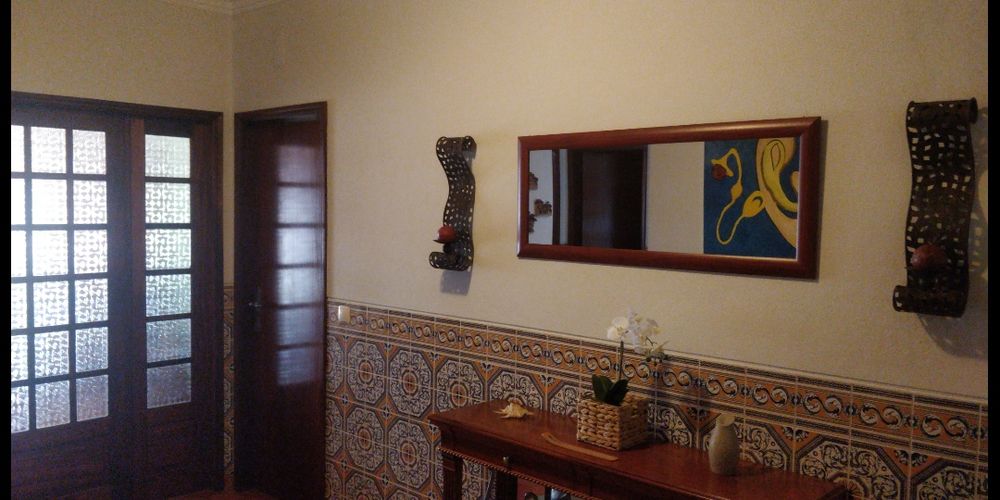 Espelho e castiçais