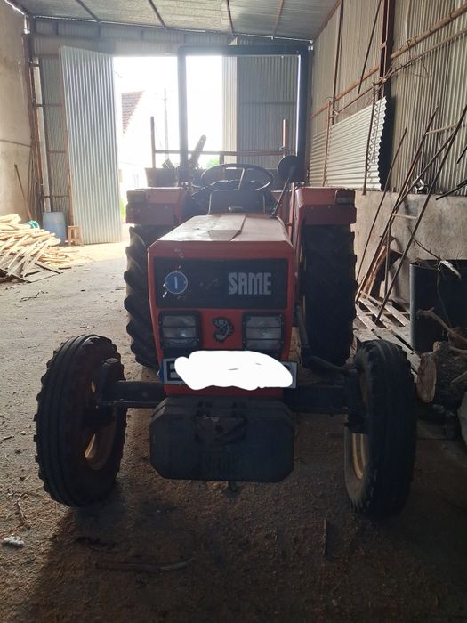 Vende-se trator com reboque tri-basculante e frese