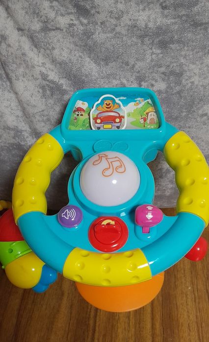 Іграшки розвиваючі інтерактивні кермо гармошка квітка мікрофон Vtech
