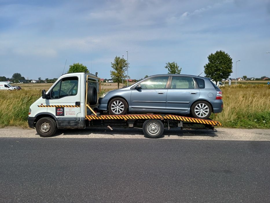 Pomoc drogowa laweta transport pojazdów maszyn Bełchatów TANIO