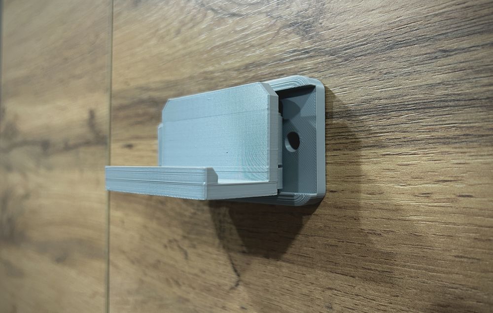 Suporte de parede para telemóvel giratório