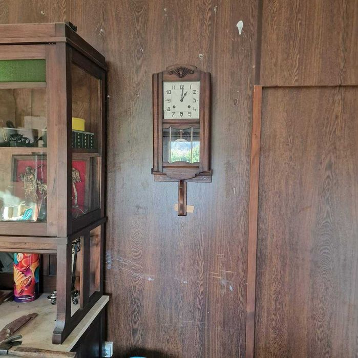 Relogio de parede com pendulo