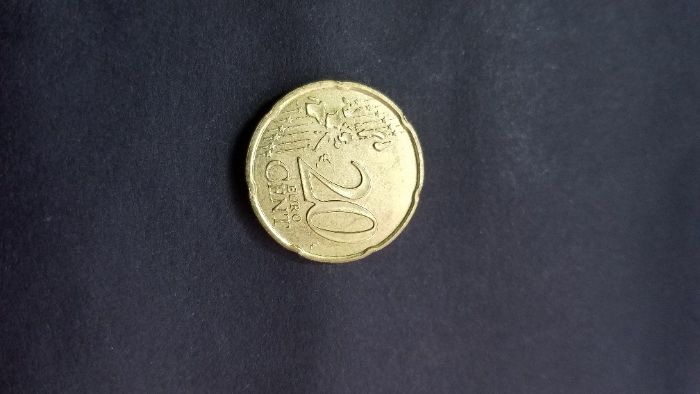 Moeda de 20 centimos Mónaco 2002 com defeito de cunhagem