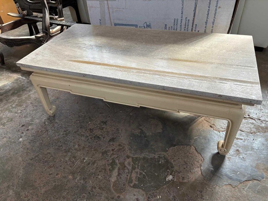 Low coffee table with stone top.