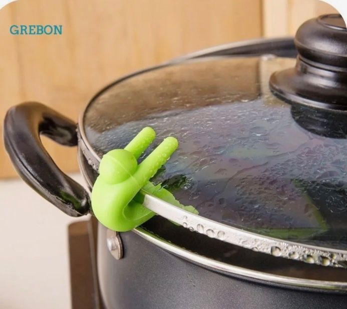 Салатовий тримач кришок (кухня).