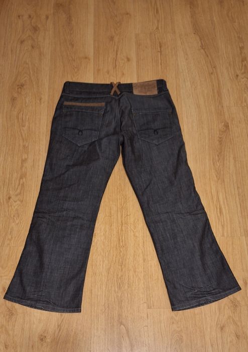 Spodnie, jeansy, dzwony z  rozszerzanymi nogawkami na dole. Rozmiar L