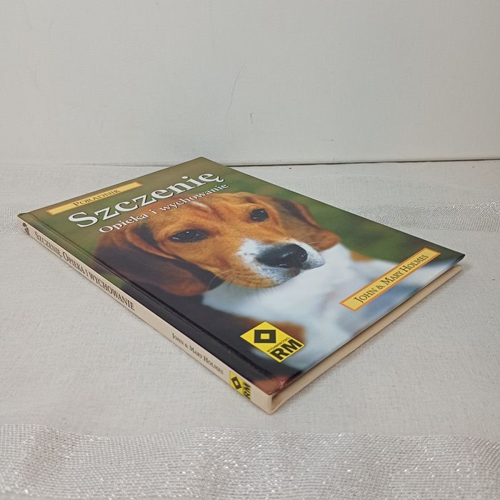 Szczenie opieka i wychowanie. John Mary Holmes