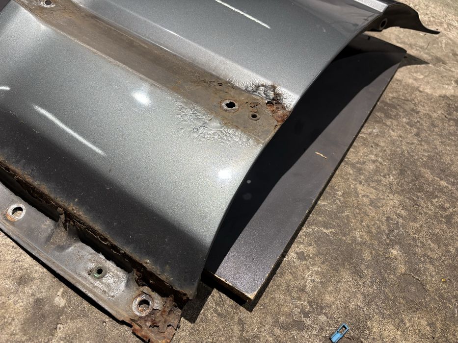 Błotnik lewy przód BMW E32 delphin