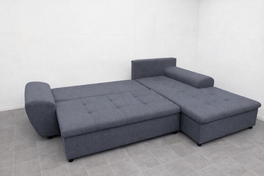 Szary narożnik rozkładany z funkcją spania używany transport