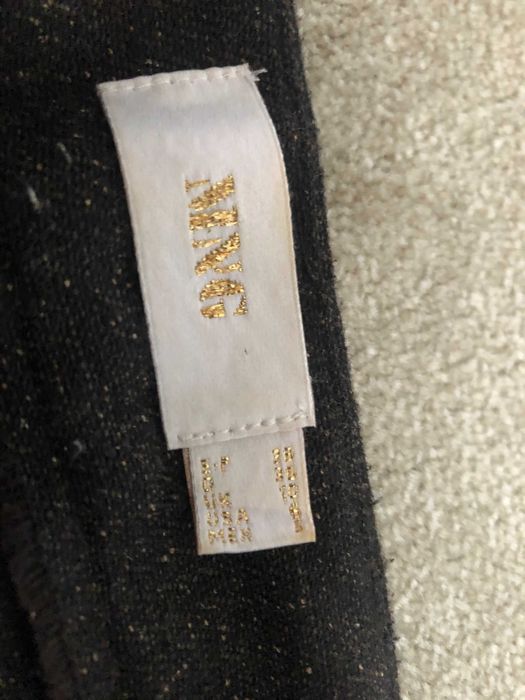 Calças castanhas com pintas beges Mango