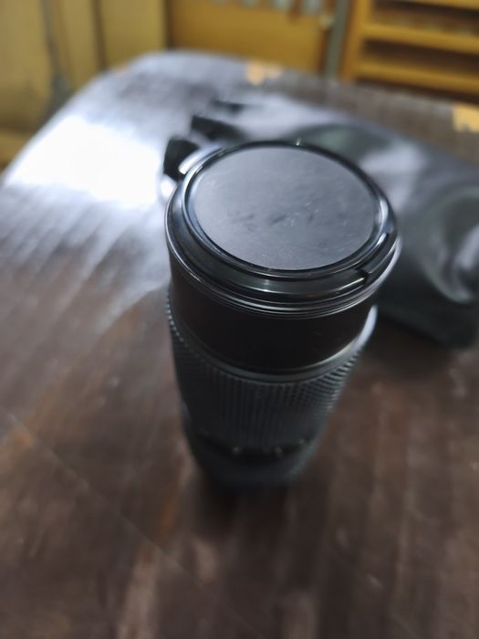 Objetiva máquina fotográfica
