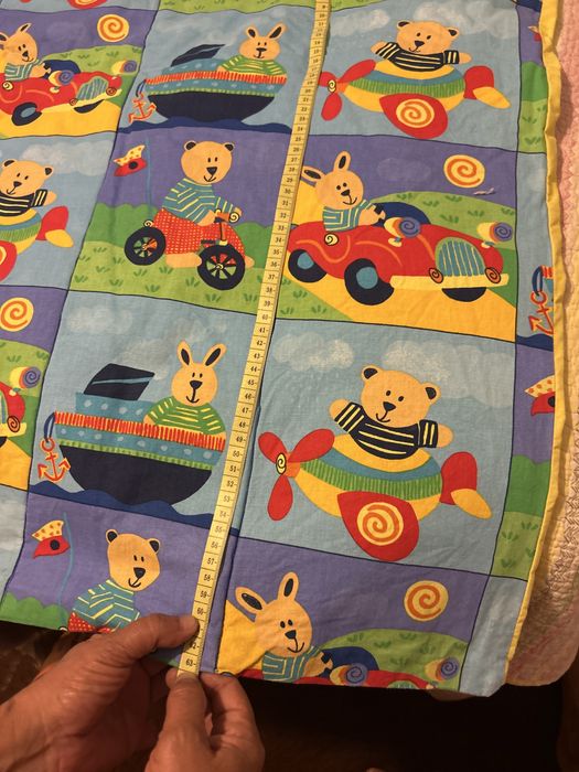 Colcha enderdon  de criança ilustrada.