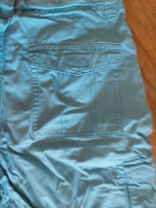 Calções com bolsos de lado