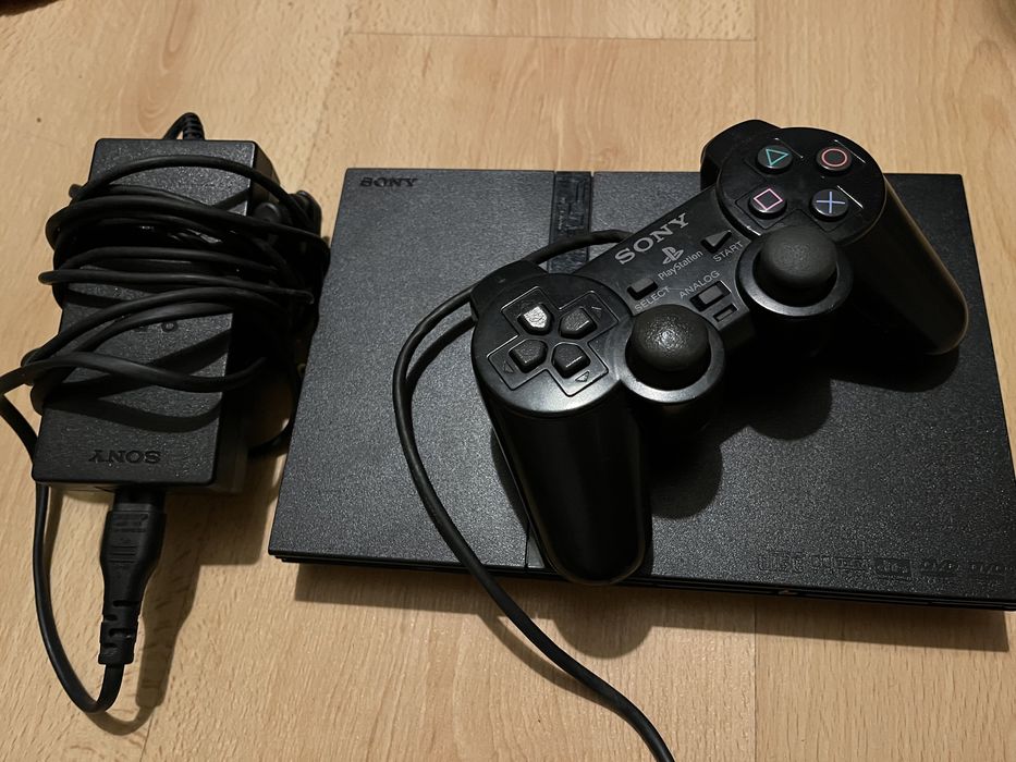 PS2 with controllers, games, and microphone for SingStar Latino64172206791810123