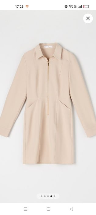 Beżowa sukienka z kołnierzykiem i złotym zamkiem