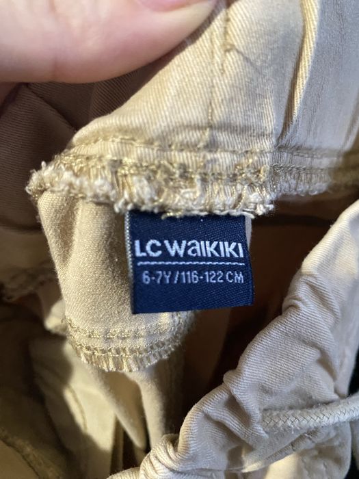 Бежеві штани для хлопчика 116-122