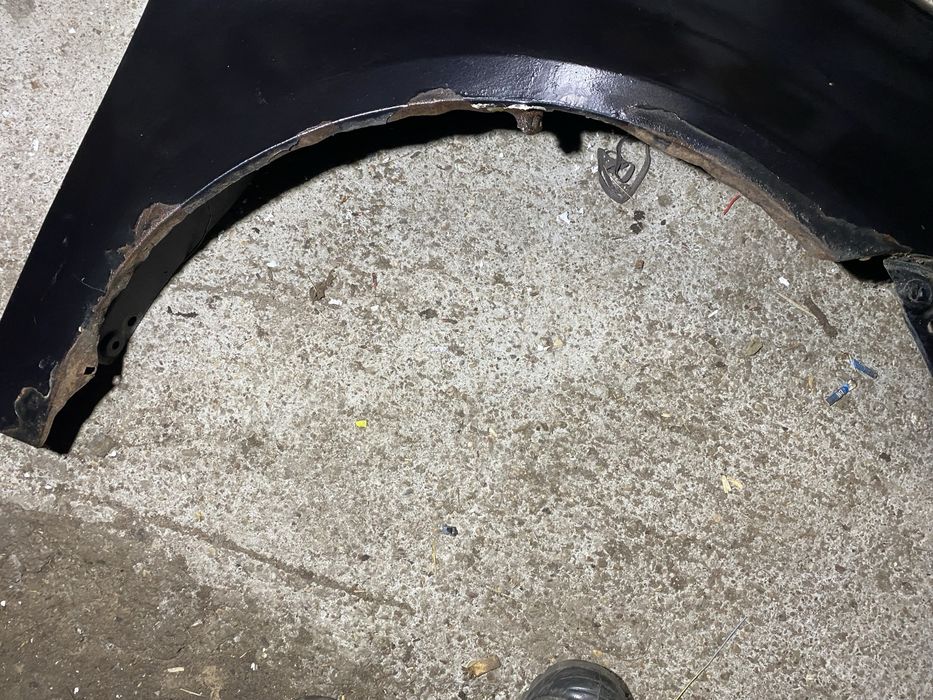 Błotnik przód prawy VW Touran lift 06-10r czarny