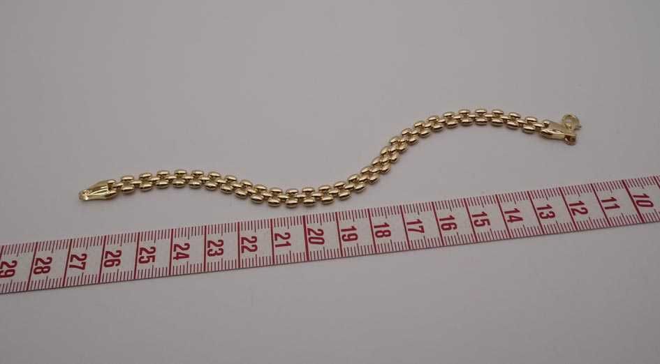 Złota bransoletka pękate ozdoby 19 cm. 6,4 mm.