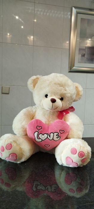 Urssinho com um coração com dizeres