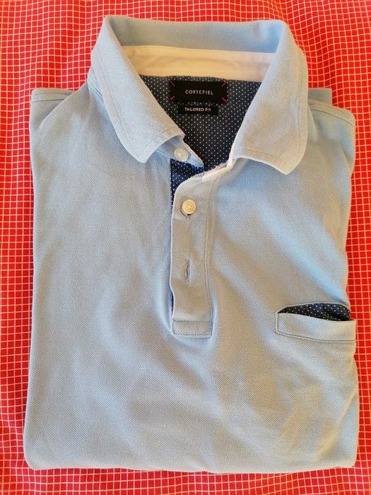 Polo azul de manga comprida