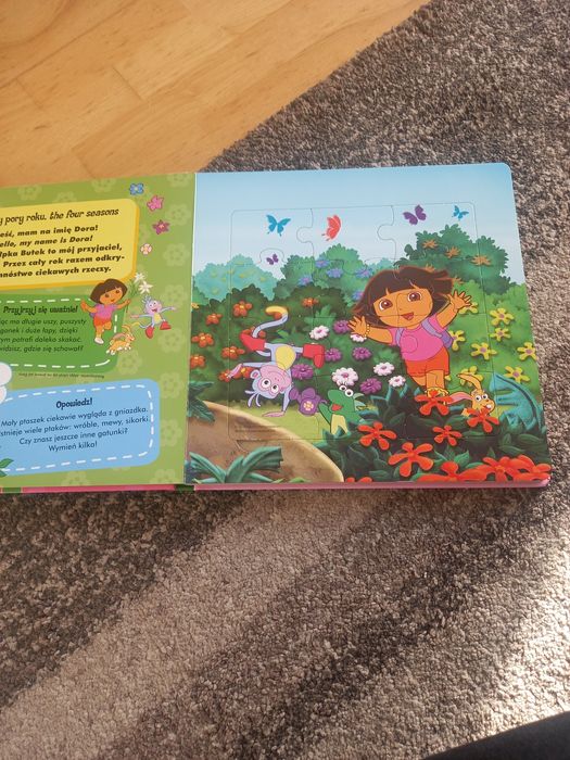 Dora poznaje świat - książka z puzzlami