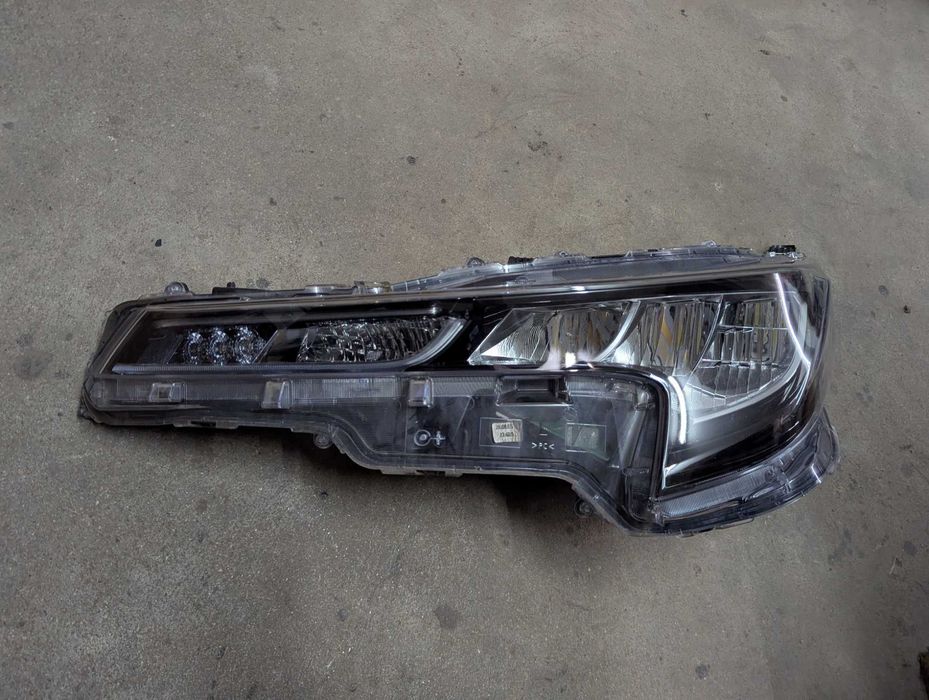 Farol/Ótica esquerda Toyota Corolla e21