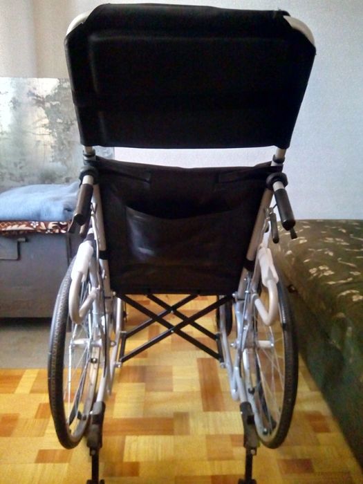 Инвалидная коляска .