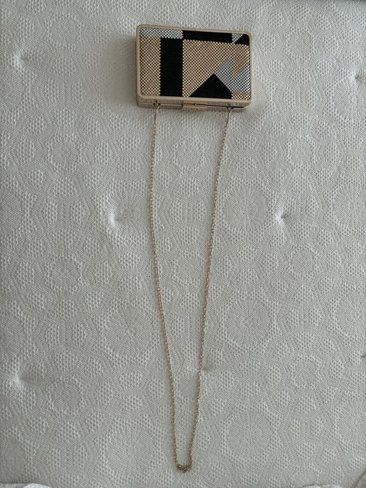 Clutch dourada da Parfois