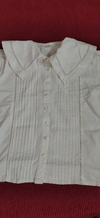 Blusa c/ gola manga curta.
