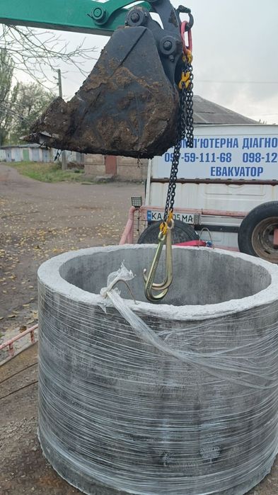 Услуги экскаватора с функцией крана. Работаем как и по городу так и за городом