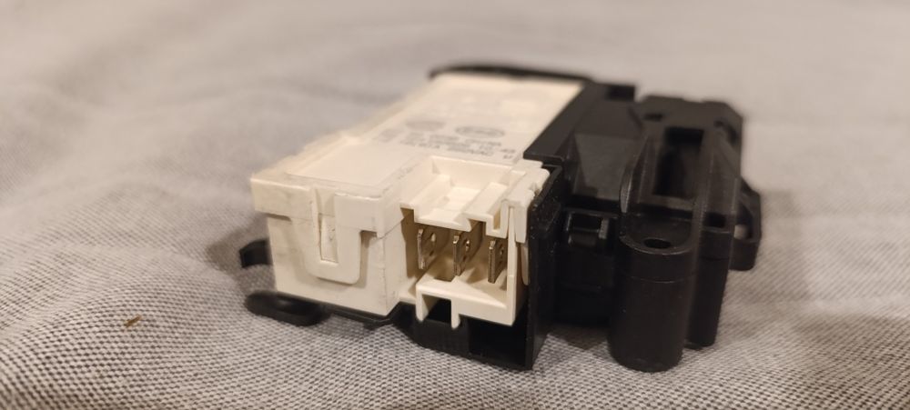 Mechanizm blokady drzwi do pralki Amica TAW 7123 LCW