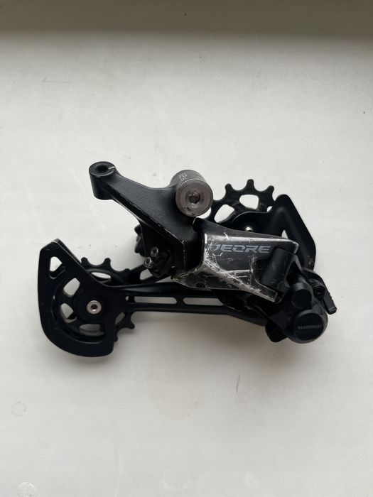 Задній перемикач і манетка Shimano Deore SL-M6100, 12 швидкостей
