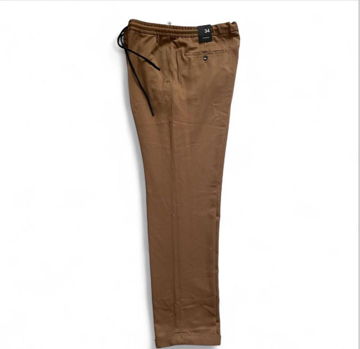 Штани чоловічі 34р. Світло-коричневого кольору літні  Нові