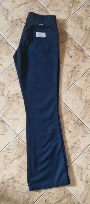 Spodnie wrangler model z szeroką nogawka rozm 33 - 34