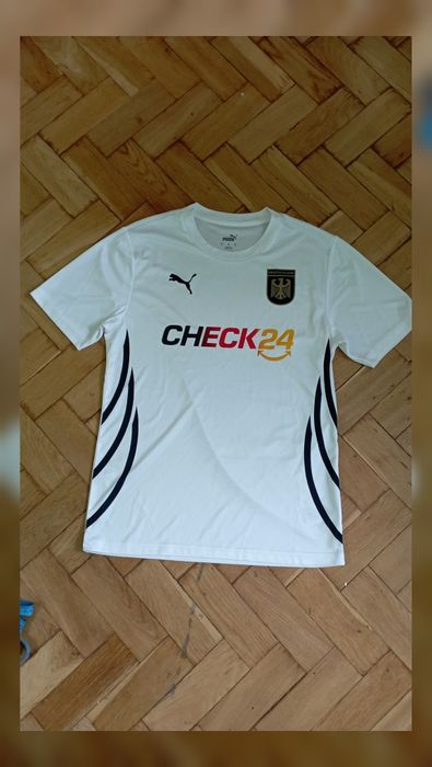 Koszulka Puma Deutschland
Biała koszulka sportowa Puma z logo Deutschl